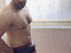 Beefy, hot Hungarian in sexy (latex?) briefs, shows off his big bulge gif